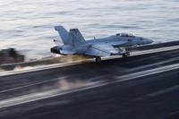 This image taken from video provided by the U.S. Navy shows an aircraft launching from the USS Harry S. Truman in the Red Sea before airstrikes in Sanaa, Yemen.