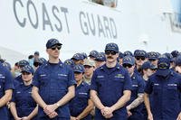 U.S. Coast Guard members stand in a group