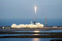 SpaceX Falcon 9 rocket, with a crew of four aboard the Crew Dragon spacecraft, lifts off