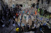 Yemenis crowd at Farwah popular market, which Houthis said was struck by U.S. airstrikes, in Sanaa, Yemen.