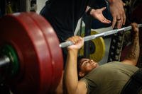 A U.S. soldier assigned to the 20th Engineer Brigade powers through a bench-press attempt during the Castle Week powerlifting competition at Fort Bragg, N.C.