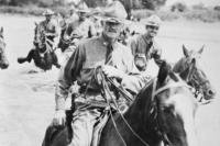 Gen. John J. Pershing, at the head of his men, fords a stream in Mexico in 1916 while leading the United States troops there in pursuit of Pancho Villa.