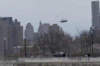 In this photo taken from video, a helicopter falls from the sky into the Hudson River