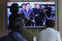 A TV screen shows a file image of North Korean leader Kim Jong Un during a news program