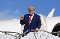 President Donald Trump arrives on Air Force One at Morristown Municipal Airport in Morristown, New Jersey.