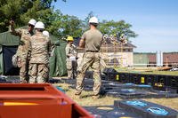 Soldiers restore roofs on buildings at Camp Grayling