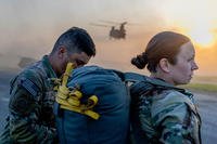 Paratroopers rig up a parachute for a CH-47 Chinook airborne operation
