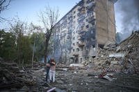 Residents react after a Russian missile hit a multi-storey apartment during Russia's combined missile and drone air attack in Kyiv, Ukraine