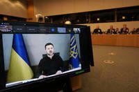 Ukraine's President Volodymyr Zelenskyy, via video link, delivers a statement to NATO defense ministers