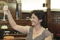 Mandonna &quot;Donna&quot; Kashanian, 64, holds up a champagne glass.