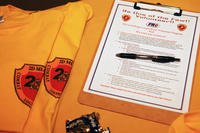 Applications sit on a table at Marston Pavilion aboard Camp Lejeune, N.C., for potential volunteers with Combat Logistics Regiment 27, 2nd Marine Logistics Group.
