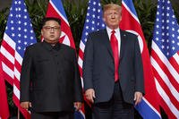 U.S. President Donald Trump, right, meets with North Korean leader Kim Jong Un on Sentosa Island, in Singapore