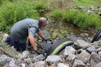 A civil engineer and water quality expert tests the water from a creek for forever chemicals at a property in Dalton, Georgia, on June 12, 2025. (Issam Ahmed/AFP/Getty Images/TNS)