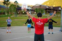 Andrew Hutchinson, an Army veteran and director of camps and special programs for Team Red, White and Blue, leads a warm-up before a calisthenics session during a rock-climbing camp at Estes Park, Colo.