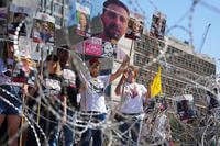 Families of hostages demand their release.