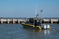 The R/V DOLPH, an autonomous vessel developed by the U.S. Coast Guard Research and Development Center (RDC), gets underway from the pier to conduct a demonstration at Coast Guard Base Galveston, Texas.