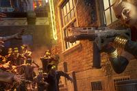Woman shooting zombies with others behind her
