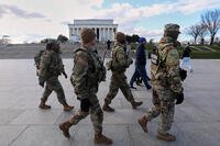 National Guard patrol the National Mall near the Lincoln Memorial.