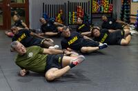 Soldiers do a thigh stretch.