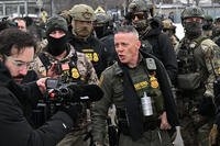 U.S. Border Patrol Cmdr. Gregory Bovino arrives as protesters gather outside the Bishop Henry Whipple Federal Building, Thursday, Jan. 8, 2026, in Minneapolis, Minn. (AP Photo/Tom Baker)
