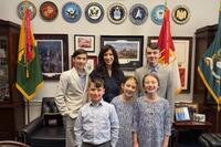Military spouse Erica Thompson and her children are photographed inside a Washington lawmaker's office. (Erica Thompson)