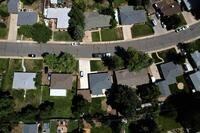 A suburban residential street pictured from overhead.