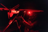 A soldier launches a drone to search for Russian attack drones.