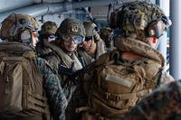 This image from video provided by U.S. Central Command shows U.S. Sailors and Marines aboard USS Tripoli (LHA 7) arriving in the U.S. Central Command area of responsibility, March 27, 2026. (U.S. Central Command via AP)