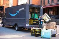 FILE - An Amazon Prime driver makes a delivery outside an apartment building in Pittsburgh, March 10, 2025. (AP Photo/Gene J. Puskar, File)