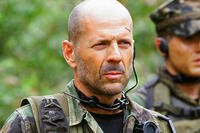Bruce Willis in military gear in Tears of the Sun, actor who grew up in a military family. (Photo courtesy of Sony Pictures Releasing)