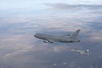 A KC-46 refuels an F/A-18 Hornet in flight.