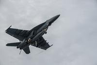 An F/A-18E Super Hornet 27 flies over the flight deck of the U.S. Navy's only forward-deployed aircraft carrier USS Ronald Reagan (CVN 76) above waters south of Japan, Oct. 16, 2015. (U.S. Navy photo by Nathan Burke)