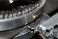 A metal embossing machine is used to make ID tags at the Soldier Readiness Processing building at Fort Knox, Kentucky. (US Army photo)