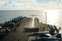 An E-2C Hawkeye launches from USS John C. Stennis' (CVN 74) flight deck with Chief of Naval Operations (CNO) Adm. John Richardson aboard on June 5, 2016, in the South China Sea. (Photo by Jake Greenberg/U.S. Navy)