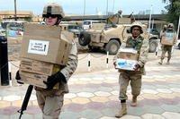 soldiers carrying boxes