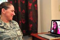 Capt. Dawn Tanner, 51st Medical Operations Squadron Family Advocacy element leader, Facetimes her wife, Dana McCown, retired lieutenant colonel, at Osan Air Base, Republic of Korea, Sept. 13, 2013. (U.S. Air Force Photo/Airman 1st Class Ashley J. Thum)