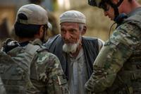 Alex Unguist, left, interpreter, and U.S. Air Force Master Sgt. Richard Holder, right, talk with the village elder Oct. 25, 2012, outside Bagram Airfield, Afghanistan. (USAF photo/Staff Sgt. Jonathan.