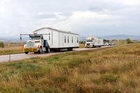 The first two manufactured housing units that are part of FEMA's response and recovery efforts related to severe storms and flooding on the Pine Ridge Indian Reservation arrived at Ellsworth Air Force Base Oct. 8, 2015. (U.S. Air Force/A1C Denise Nevins)