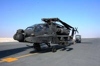 An Apache helicopters from Fort Bliss, Texas, is transported to its parking location Dec. 13, 2015, at Al Udeid Air Base, Qatar. The helicopters were scheduled to take part in the annual Qatar National Day parade (U.S. Air Force photo/James Hodgman)