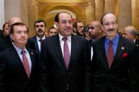 raq's Prime Minister Nouri al-Maliki, center, walks with members of the House Foreign Affairs Committee.