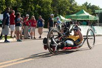 A participant in the Cycling competition of the 2015 Department of Defense (DoD) Warrior Games enters his final lap at Lejeune Hall Lot, Marine Corps Base Quantico, Va. (U.S. Marine Corps photo by Cpl. Diana Sims/Released)