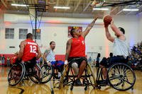 Marine Corps Cpl. Marcus Chischilly defends as retired Navy Chief Petty Officer Hector Varela takes a shot during the wheelchair basketball gold medal match at the 2015 DoD Warrior Games, June 23, 2015. (DoD photo by Shannon Collins)