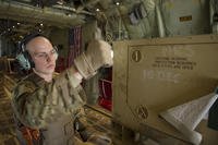 Staff Sgt. Justin King, a 774th Expeditionary Airlift Squadron loadmaster, gives a thumbs-up as a generator is offloaded from a C-130J Super Hercules at Camp Bastion, Afghanistan, Jan. 3, 2016. (U.S. Air Force photo/Tech. Sgt. Robert Cloys)