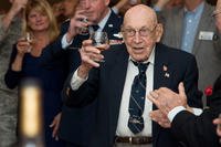 Retired Lt. Col. Dick Cole, a co-pilot in the Doolittle Raid on Tokyo, raises a glass to toast the 74th anniversary of the raid on April 18, 2016, at Joint Base San Antonio-Randolph, Texas. (Photo: Airman 1st Class Stormy Archer)