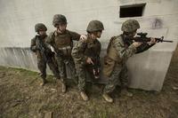 U.S. Marines assigned to the Female Engagement Team (FET), 22nd Marine Expeditionary Unit, conduct a breach training exercise at Fort Pickett, Va., Feb. 21, 2016. (U.S. Marine Corps/Lance Cpl. Koby I. Saunders)