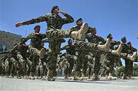 Afghanistan National Army soldiers march during their graduation ceremony at the Kabul Military Training Center in Kabul, Afghanistan, on June 1, 2014. Massoud Hossaini/AP