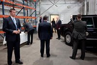 United States Secret Service agents wait as President Barack Obama signs memorabilia before departing Gamesa Technology Corporation in Fairless Hills, Pa., April 6, 2011. (U.S. Secret Service photo: Pete Souza)