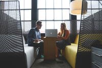 A man and woman having a meeting.