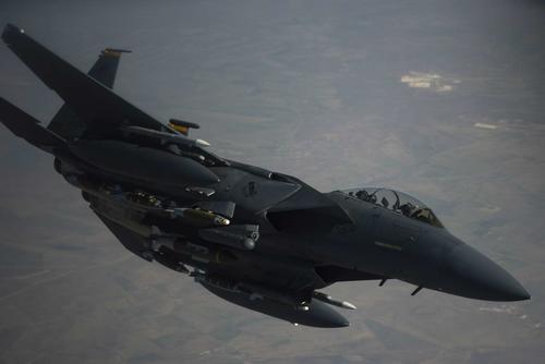 An F-15E Strike Eagle peels off from a KC-135, May 7, 2019 at an undisclosed location. (U.S. Air Force/Master Sergeant Russ Scalf)