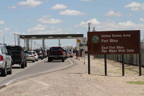 Cars wait to enter Fort Bliss in El Paso, Texas.